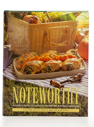 Ravinia’s Noteworthy cookbook features delectable looking appetizers, a corkscrew and picnic basket on its cover.