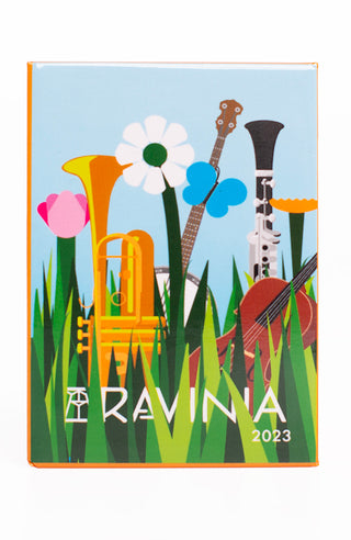 A trumpet, banjo, clarinet and string bass in thick green grass with the word Ravinia partially obscured, and a blue sky, flowers and a butterfly above.