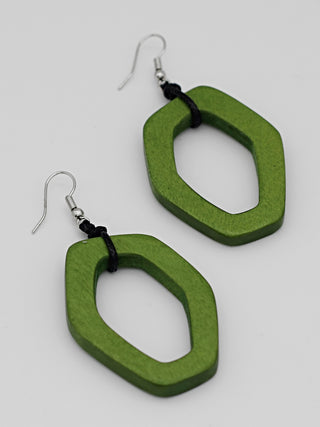 Earrings made of aa vibrant lime green wooden link, with silver hooks above.
