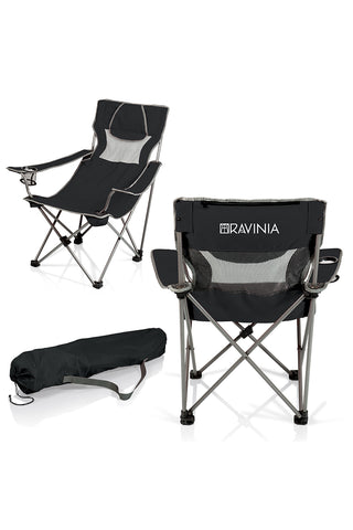 Two different views of a metal-framed camping chair with navy blue fabric. The Ravinia name and logo can be seen on the back of the chair. Next to that chair is a black carrying bag for the chair.