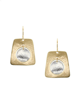 Earrings with a brass cutout tapered rectangle with a silver-toned disc hanging in the center.