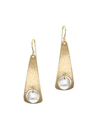 A pair of brass cutout long triangle earrings with a silver disc hanging in the center.