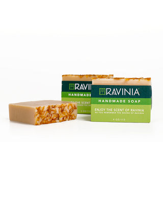 Three bars of soap, one flat and two upright, with the two uprights ones having a Ravinia label on them.