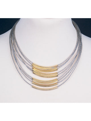 Gold-plated bronze bars on gold-toned twine necklace on a white mannequin.