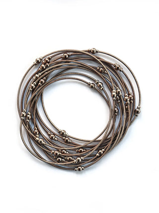 Copper-toned loop bracelets with copper beads.