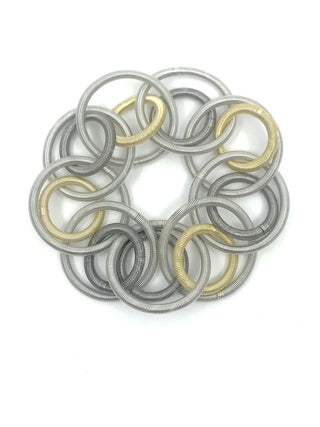 bracelet made of three different tones of soft, supple piano wire