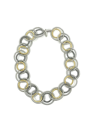 Overview of a multi-toned necklace made of loops, with a magnetic closure at the top.