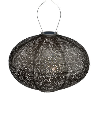 A taupe, oval shaped lantern made of Tyvek, with a handle at the top for hanging.