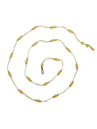 The Loopy Duo Peridot Champagne necklace in a spiral.