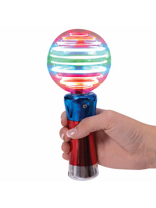 A hand holding a red white and blue light up stick with red, blue, and green lights.