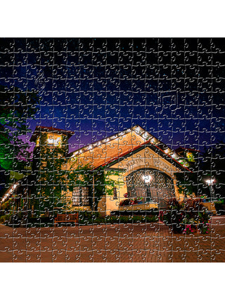 A wooden puzzle depicting the Martin Theatre at night.