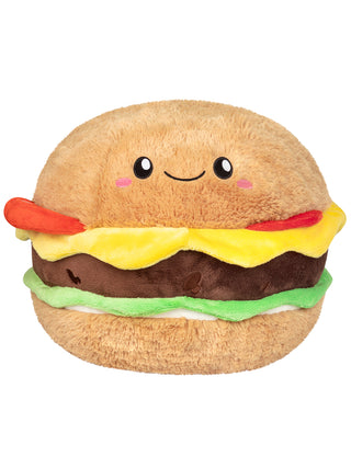 A plush version of a cheeseburger, with the top bun containing a smiling face.