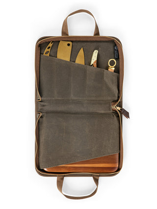 An open green canvas case with cheese knives partially visible.