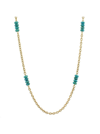 A long brass link chain necklace interspersed with four turquoise bead stacks.