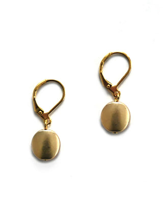A pair of gold-toned disc earrings with hooks.