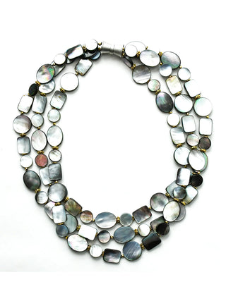 A black and gray tones mother of pearl necklace with three strands of oval and a magnetic clasp.