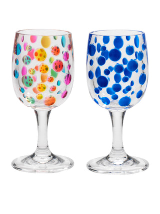 Two acrylic wine glasses, the one on the left with a rainbow circles pattern, the one on the right with a blue sapphire colored circles pattern.
