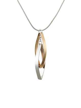 A pendant made of two interlocking pointed ovals made of brass and silver, on a silver snake chain.