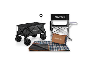 A gray wagon, black chair with a side table, and a plaid ground blanket in front of a white background.