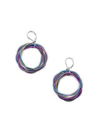 A pair of multicolored twisted piano wire earrings with silver clasps.