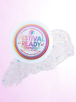 A pot of festival ready biodegradable glitter gel for hair, face & body on top of a  smear of clear glitter gel.