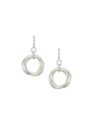 A pair of silver earrings made up of a cluster of silver rings.