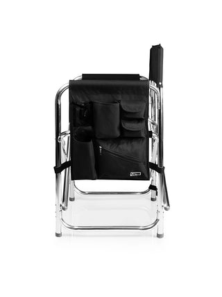 A black sports chair from a side view, showing the armrest caddy with two beverage holders and multiple storage pockets.