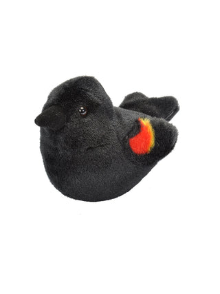 A black stuffed bird with red feathers on its wings.