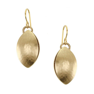 Earrings comprised of brass leaf pods made up of two back-to-back leaves. 