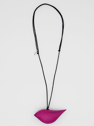 A fuschia wooden bird pendant hangs on an adjustable black wax cord.