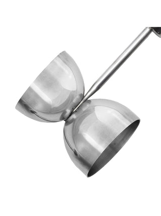 Close up of a stainless steel double jigger.