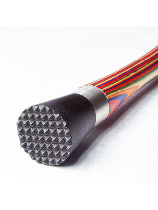 The studded black rubber end of a drink nuddler.