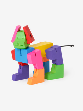 A multicolored robot dog, viewed from the side, its face looking forward.