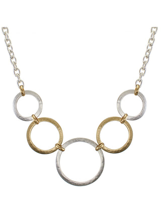 Five tiered back to back hoops, alternating in silver and brass colored metal,  on a silver link chain.