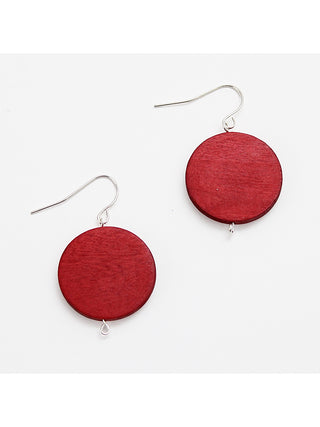 A simple red wood bead hangs from a silver plated French hook.