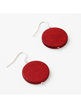 A simple red wood bead hangs from a silver plated French hook.