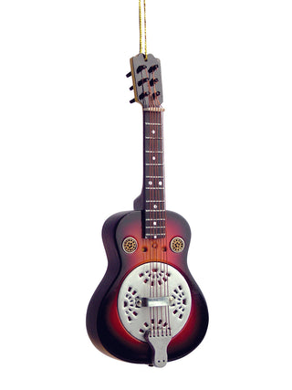 An ornament that looks like a spider resonator guitar with a gold cord for hanging.