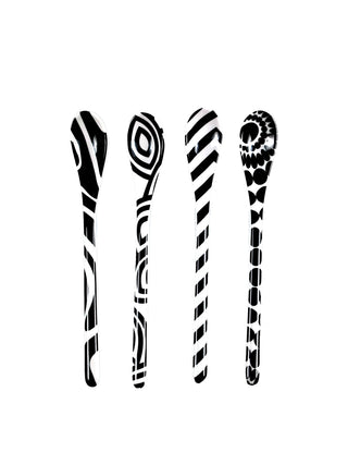 Four spoons in a row, each with a unique black-and-white pattern.