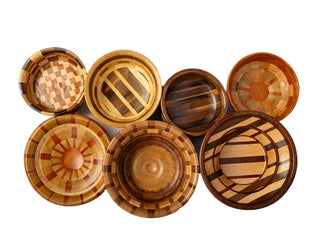 A group of segmented wooden bowls, pictured from above.