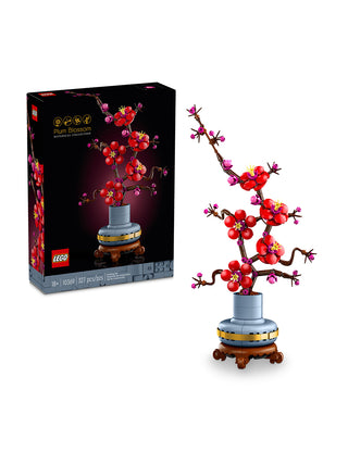 The LEGO Botanicals Plum Blossom box next to the assembled LEGO Plum Blossom plant.