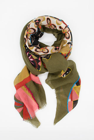 A styled scarf with a pattern in khaki, pink, green and red.
