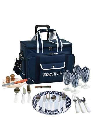 A blue picnic cooler with Ravinia branding, and spread out in front of it, a cutting board, knife, salt and pepper, four checked glasses, a corkscrew, and plates and cutlery for four.