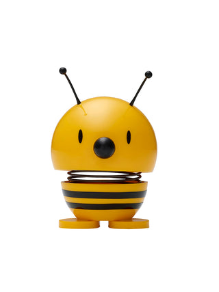 A yellow figure with black stripes and a spring in its middle that looks like a bee.