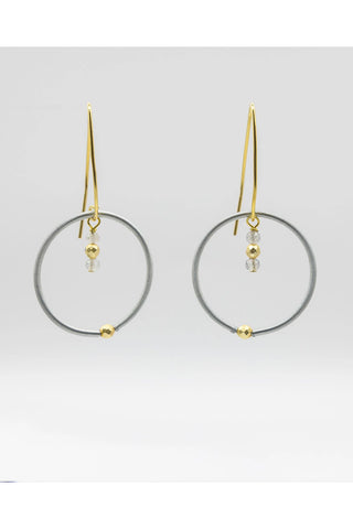 Earrings with gold-toned wires, silver piano wire loops and tiny labradorite drops.
