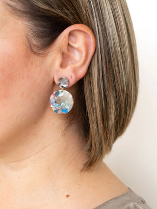 A model with blond hair wearing the multicolored Addy earrings.