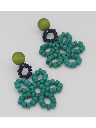 Angled view of ocean-toned earrings made of up loops of beads.