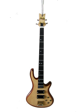 An ornament in the shape of a bass electric guitar, hanging on a gray string.