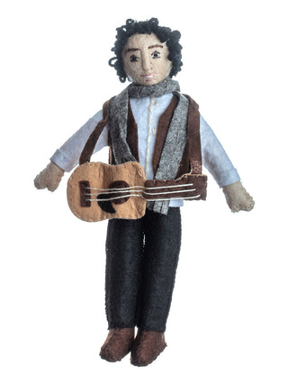 A felt ornament of Bob Dylan with a scarf and a guitar.