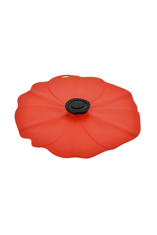 A red silicone lid in the shape of a poppy, with a black handle in the center.