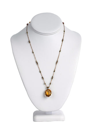 The short citrine necklace on a model neck.